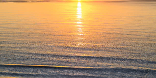 istock Ocean reflecting the setting sun in San Diego CA 1060788462