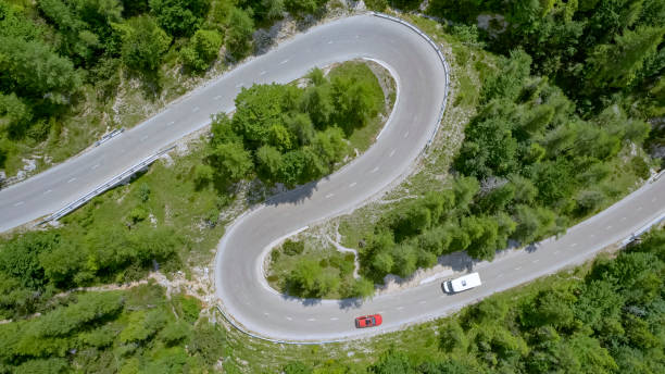 istock Vehicles moving on winding road 1060789122