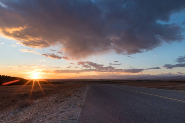 istock asphalt road with sunset glow 1060789390