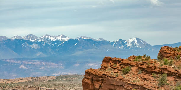 istock Cliff with snow capped La Sal Mountain in Moab UT 1060792088