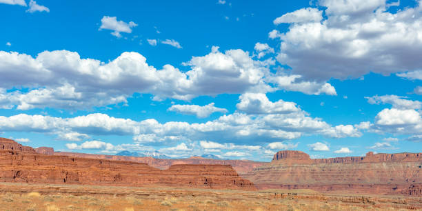 istock Dramatic canyon and mountain peaks under blue sky 1060792134