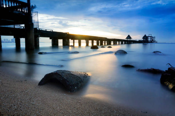 istock The long bridge over the sea with a beautiful sunrise. 1060794138