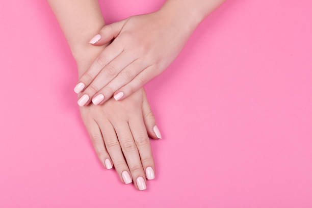 istock Stylish trendy female pink manicure. 1060795568