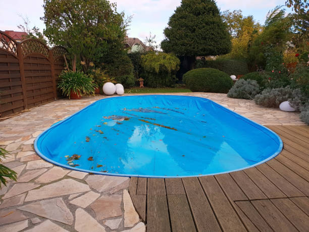 istock Pool with tarpaulin in winter cover 1060797488