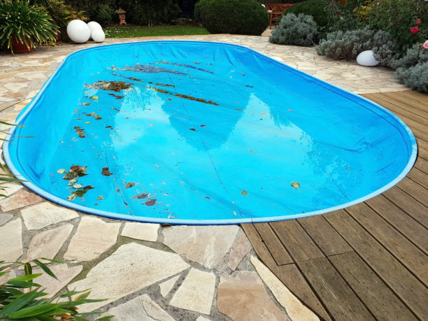 istock Pool with tarpaulin in winter cover 1060797492