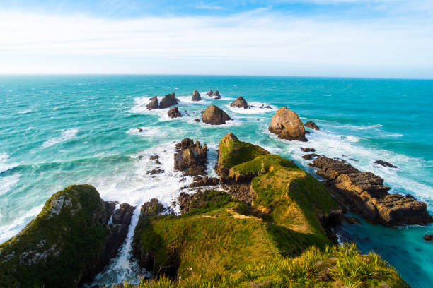 istock Nugget Point, Rocks cliffs, and beautiful ocean. The Catlins, New Zealand. 1060800704