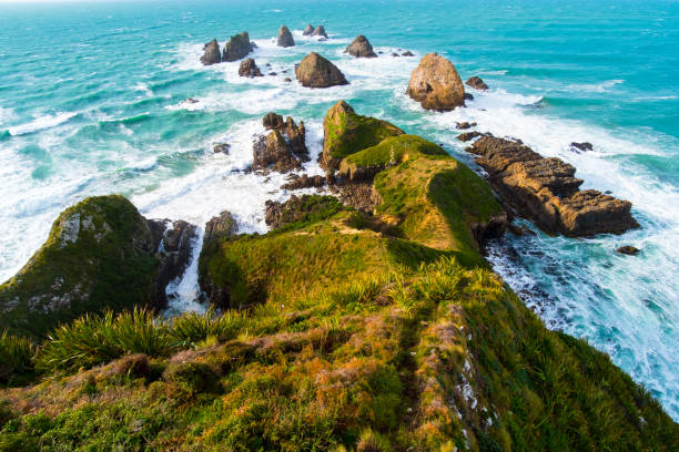 istock Nugget Point, Rocks cliffs, and beautiful ocean. The Catlins, New Zealand. 1060800714