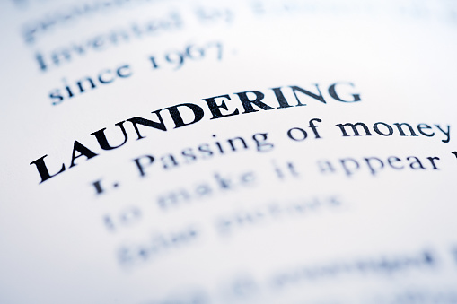 In a list of business and financial terms, 'Laundering'' is defined.