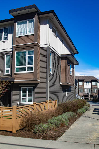 istock Modern low rise wood frame complex. Brand new apartment building on sunny day in spring. 1060808546