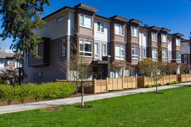 istock Modern low rise wood frame complex. Brand new apartment building on sunny day in spring. 1060808588