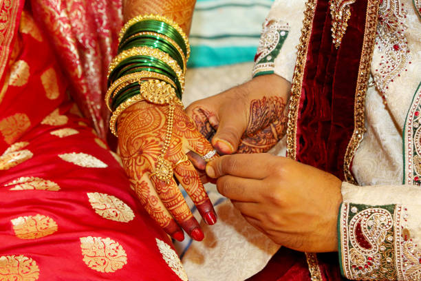 istock Engagement ring exchange, a ritual which takes place before Hindu wedding. Pune, Maharashtra 1060808736