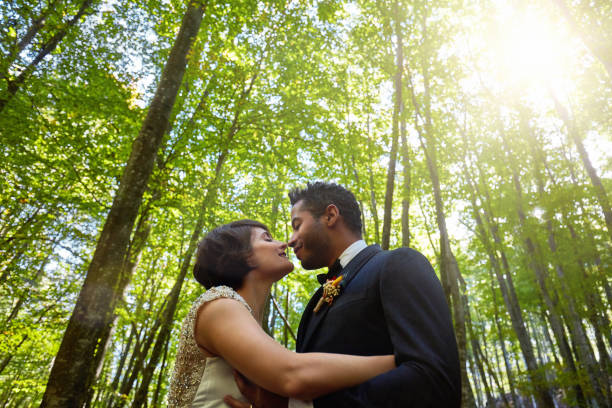 istock Happy multi-ethnic couple just married in the woods 1060809062