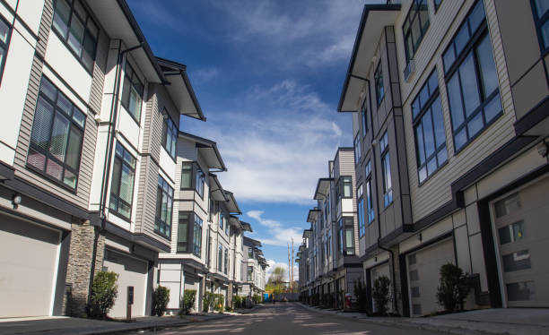 Rows of townhomes side by side. External facade of a row of colorful modern urban townhouses. brand new houses just after construction on real estate market stock photo