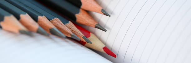 istock Red pencil standing out from crowd of plenty 1060813958
