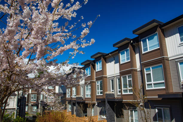 istock New modern low rise appartament complex on a sunny spring day with blooming sakura trees. 1060814476