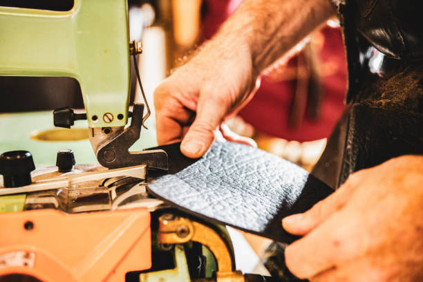 istock A saddle maker making a custom made saddle.  Real person, real life. 1060819290
