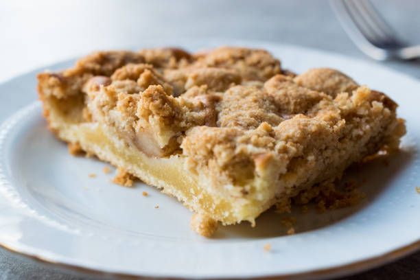 Homemade Apple Crumble Cake Slice with Fork. Organic Dessert.