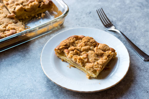 istock Homemade Apple Crumble Cake Slice with Fork. 1060823352