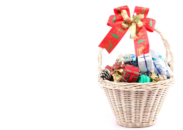 istock Christmas decorations in a basket against a white backdrop. 1060826358
