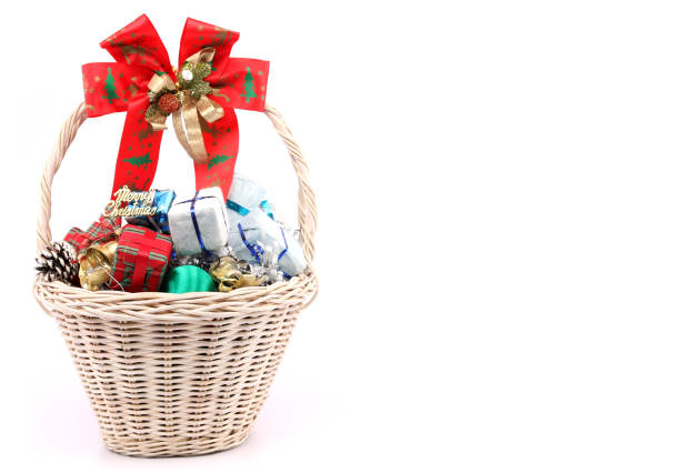 istock Christmas decorations in a basket against a white backdrop. 1060826368