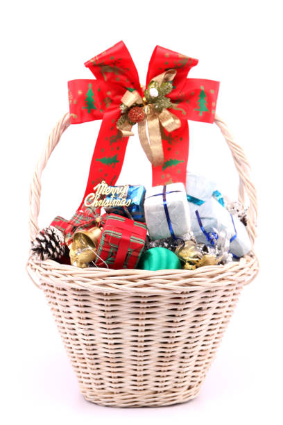 istock Christmas decorations in a basket against a white backdrop. 1060826404