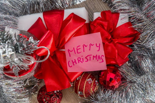 istock Gift boxes with garland and greeting card 1060831068