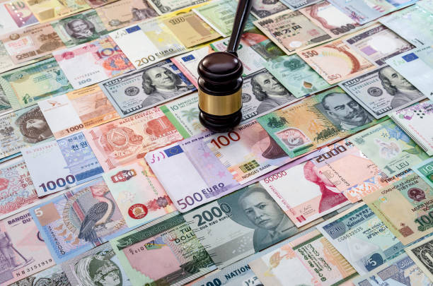 istock Judge hummer on various banknotes background close up 1060831442