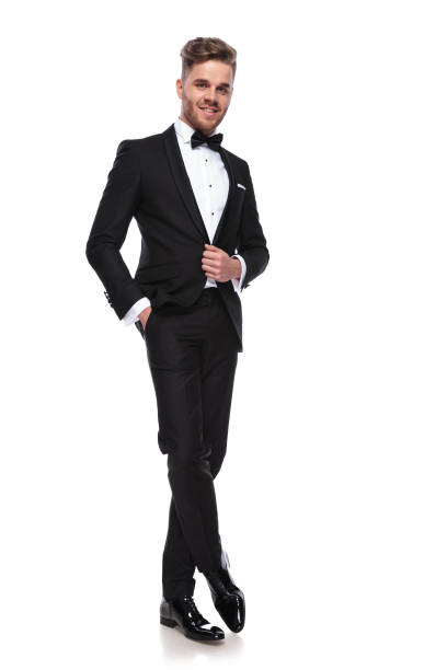 istock happy young groom holding his coat's button 1060835436