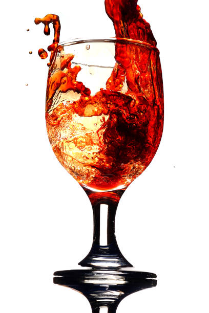 istock Splash red wine in a glass 1060838096
