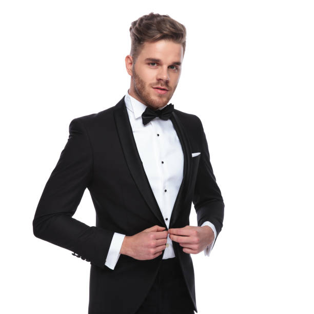 istock young elegant man buttoning his tuxedo 1060838210