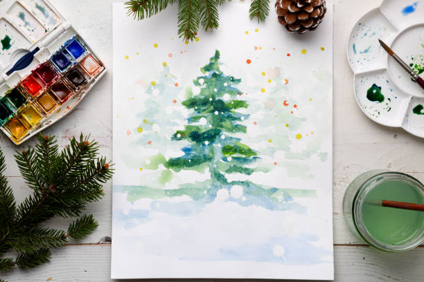 istock Handmade watercolor Christmas card on the work table 1060838918