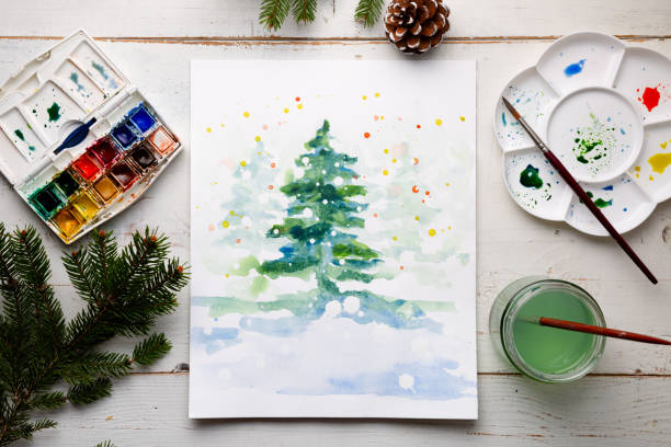 Painting a DIY Christmas card with watercolor - fotografia de stock