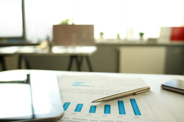 istock Silver pen lie at important paper on table 1060846482