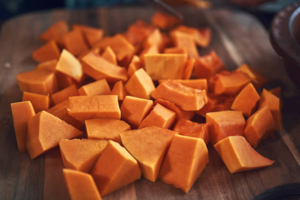istock Cutting Fresh Pumpkins on Cutting Board 1060857758