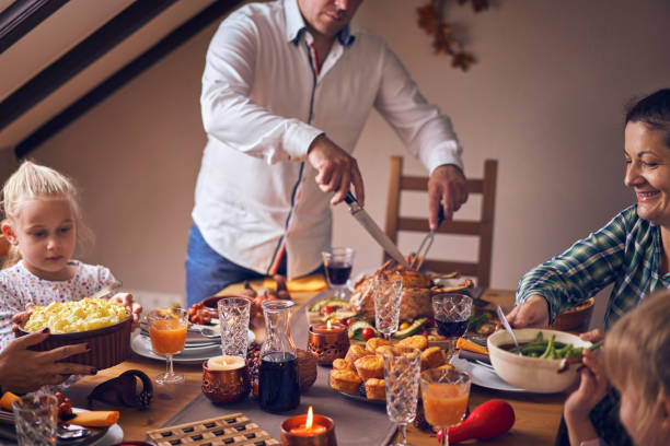 istock Family Having Traditional Holiday Stuffed Turkey Dinner 1060858028