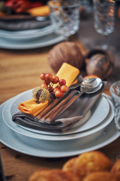 istock Decorated Table for Thanksgiving Dinner with Candles, Pumpkins, Leafs and Nuts 1060858038