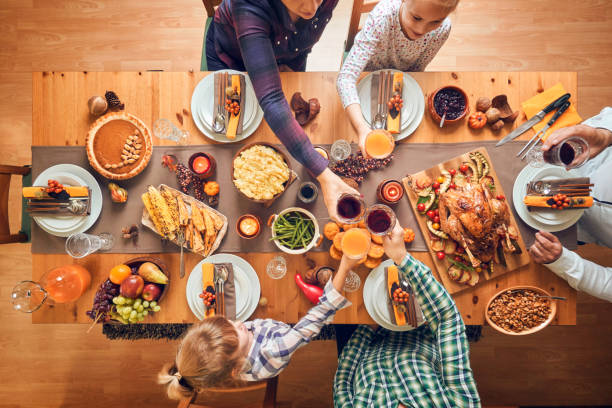 istock Family Having Traditional Holiday Stuffed Turkey Dinner 1060858058