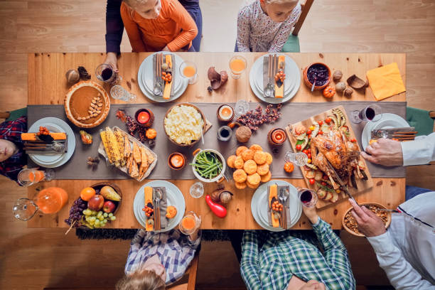istock Family Having Traditional Holiday Stuffed Turkey Dinner 1060858060
