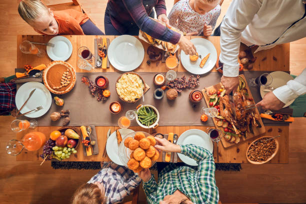 istock Family Having Traditional Holiday Stuffed Turkey Dinner 1060858070