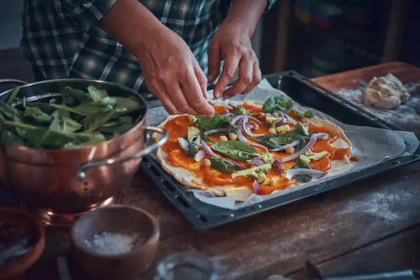 Photo of Preparing Vegan Pumpkin Pizza with Broccoli, Chickpeas and Spinach