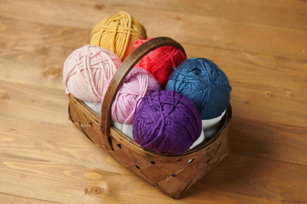 istock colorful wool threads for knitting on wooden background 1060860736
