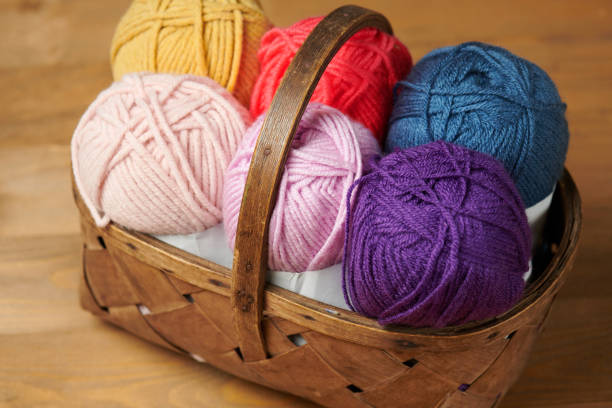 istock colorful wool threads for knitting on wooden background 1060861160