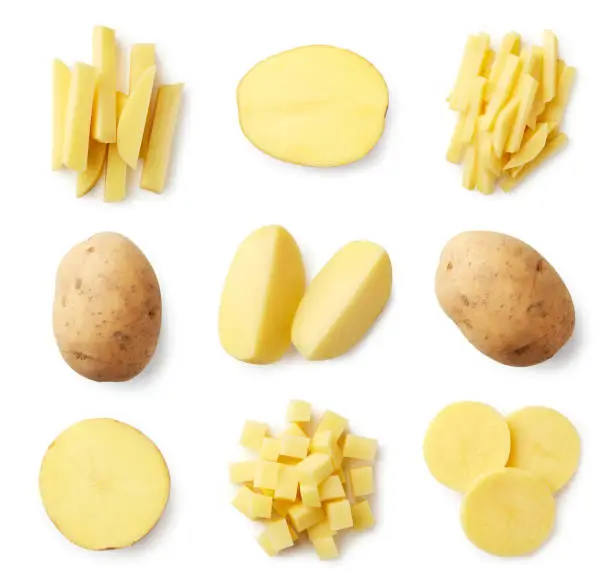 Set of fresh whole and sliced potatoes isolated on white background. Top view