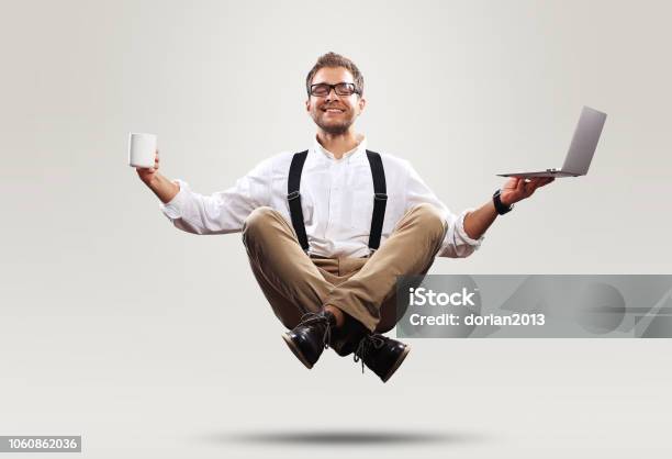 Young Man Is Soaring In The Air Stock Photo - Download Image Now - Working, Office, Occupation