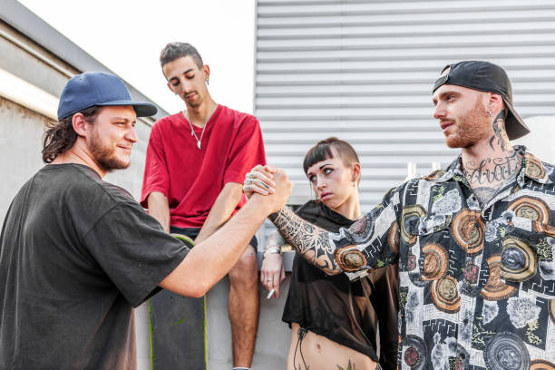 istock two friends rappers shaking hands against the wall 1060864562