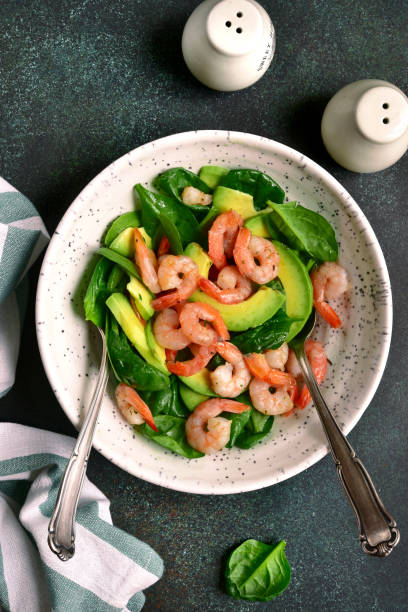 istock Avocado salad with baby spinach and shrimps 1060865172