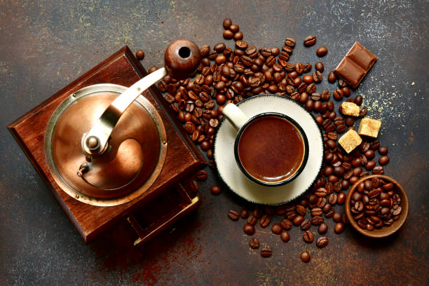 istock Cup of hot coffee with ingredients for making 1060866304