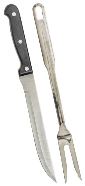 istock Stainless Steel Carving Knife And Carving Fork Isolated On White Background 1060867176