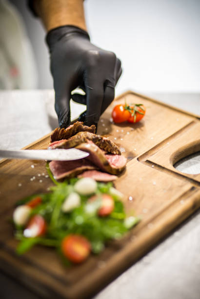 istock Chopping the beefsteak on Wooden Cutting Board 1060867528