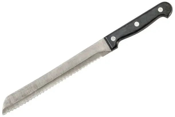 Old heavy duty stainless steel serrated Bread knife, isolated on white background.